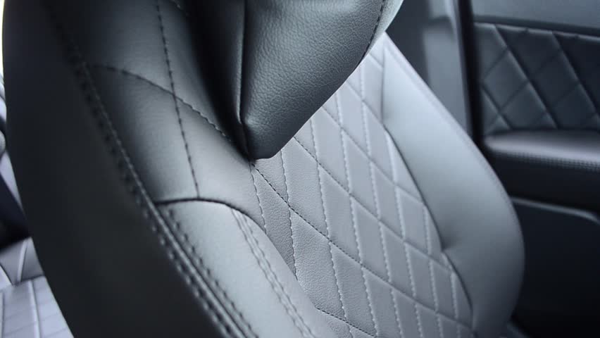 Black leather seat covers in car. Royalty-Free Stock Footage #31543870