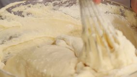 Sponge cake: flour being added