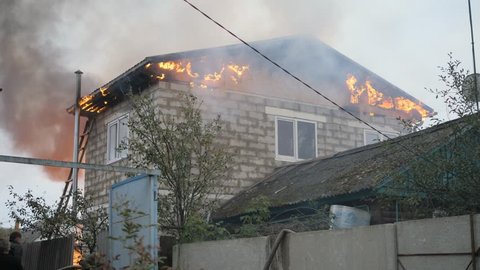 Efremovskay street, Mtsensk, Russia, 2017.05.10. Editorial - Disaster. A firefighter works on a fire. Fire in a private house