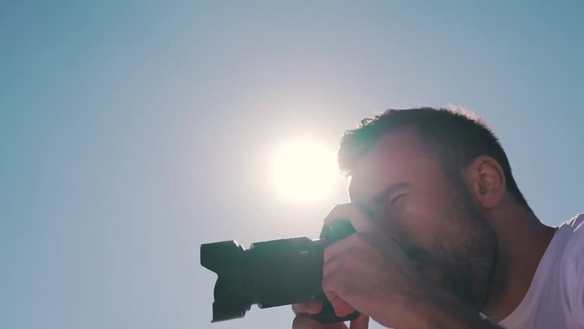 a man takes a photo.
