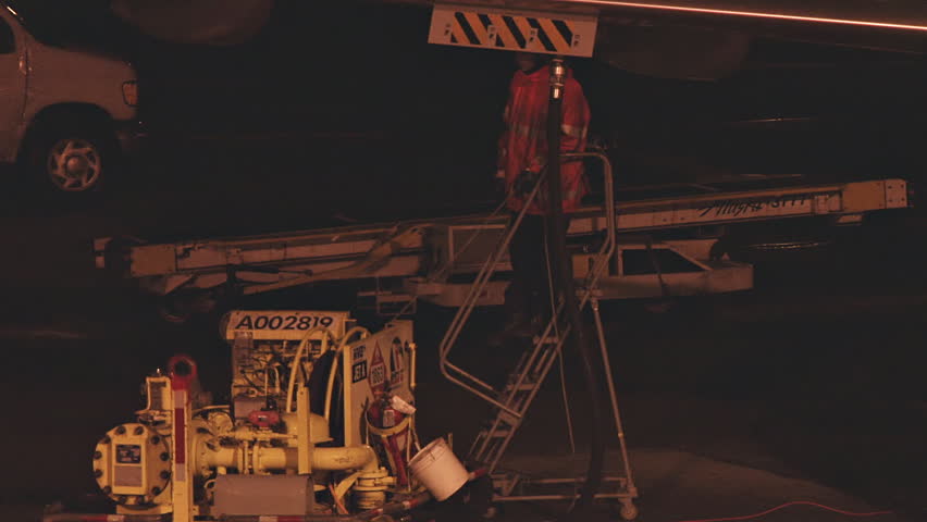 HOMER, AK - CIRCA 2012: Refueling an airliner at night.