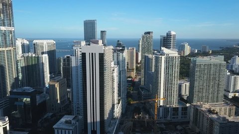 4K Aerial shot through buildings in Miami Downtown