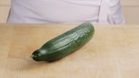 A cucumber being peeled