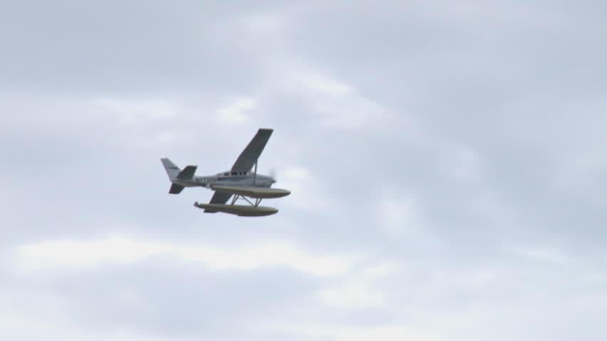 HOMER, AK - CIRCA 2011: A float plane hurls itself into the cloudy sky.