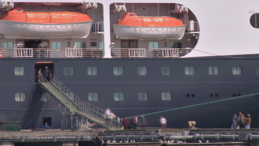 HOMER, AK - CIRCA 2011: Passengers reboarding a cruise ship, timelapse.