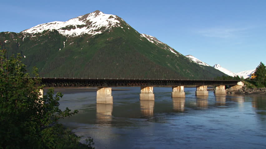 GIRDWOOD, AK - CIRCA 2012: Alaska Railroad Passenger Tour Train crossing over 20