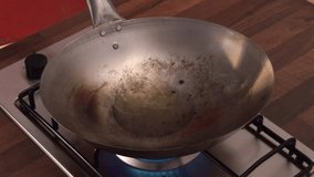 sautéing vegetables in a wok