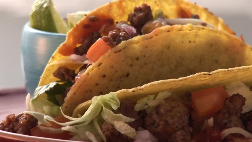 Taco shells filled with mince, fresh coriander