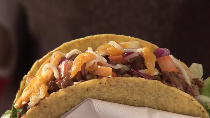Taco shell filled with mince and salsa