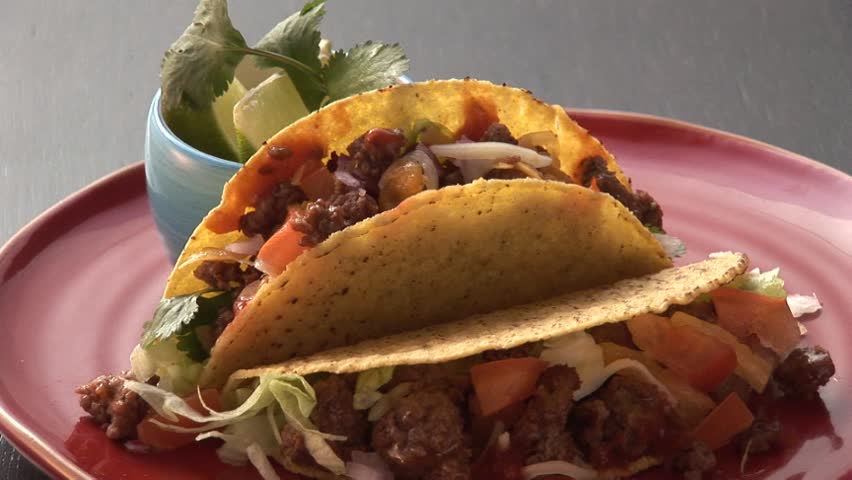 Taco shells filled with mince and salsa