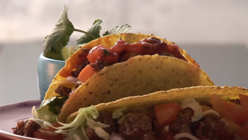 Taco shells filled with mince and avocado