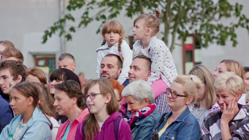 Warszaw, Poland - July 2017: Sari Makela Performes The Great Granny Show during Festival Sztukmistrzow. Girls and boy on the shoulder of their fathers. | Shutterstock HD Video #31570000