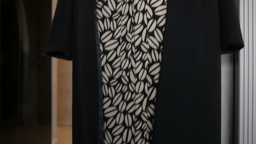 Pretty woman in coffee-patterned dress