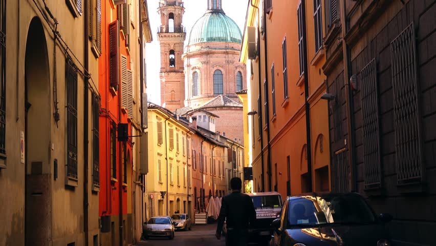 Video of street of Reggio Emilia with view of the church of San Giorgio with bell tower and dome. Reggio Emilia, Italy; 9/10/2017