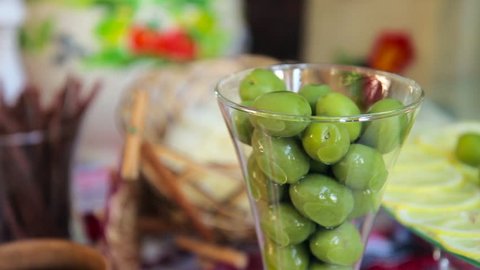 green olives on buffet bar. green olives in a glass. 