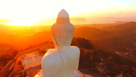 Aerial: Amazing Golden Sunrise at White Big Buddha Statue Temple. HD 1920x1080. Phuket, Thailand.