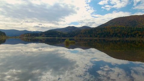 Aerial drone view of amazing autumn colors on the lake. Cerknisko lake, Slovenia 4k