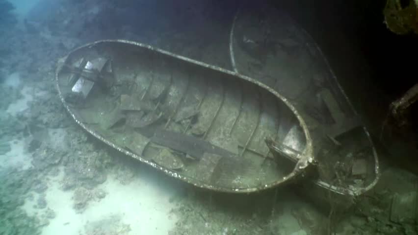 Sunken drug smuggling ship shown at night on the bottom of the sea in ...