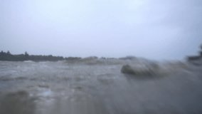 Waves on the ocean. The camera goes under water. Video recorded in slow motion. 