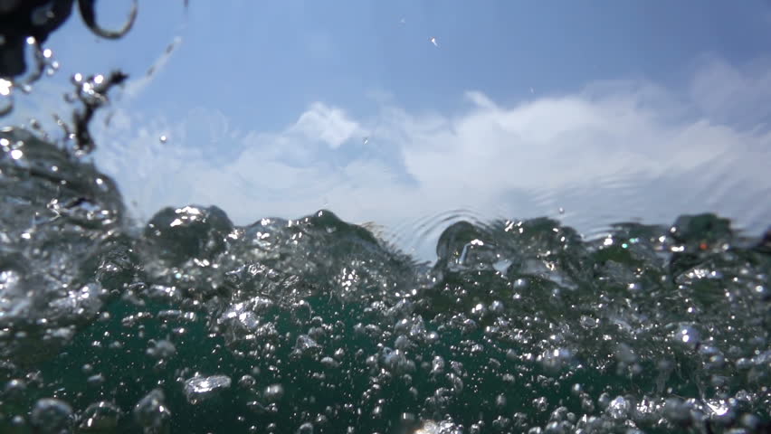 Waves on the ocean. The camera goes under water. Video recorded in slow motion.  Royalty-Free Stock Footage #31583908