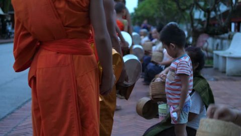 Buddhist Monks Walking On Street At Alms Giving Ceremony. Luang Prabang, Laos, 23 August, 2017. HD, 1920x1080. 