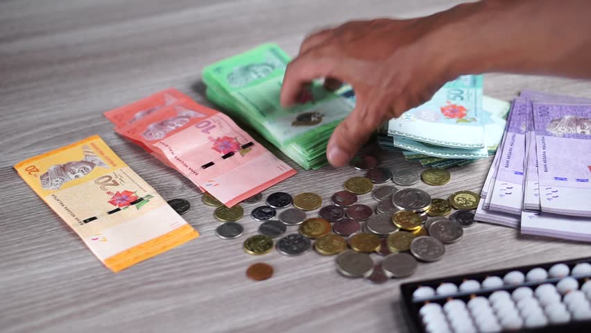 Human hands count money (Ringgit Malaysia) using Abacus. Traditional Method. Financial concept. | Shutterstock HD Video #31591765