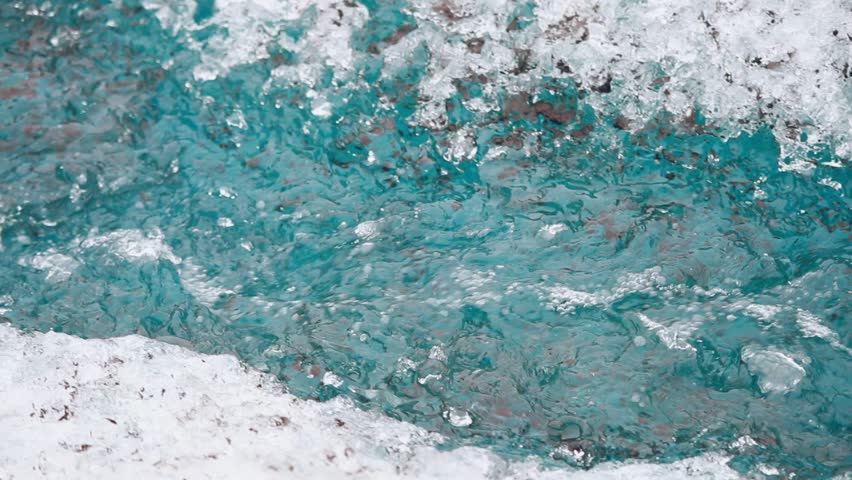 Ice river flows from melting glacier. 