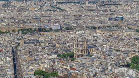 Top view of Paris skyline from above timelapse. Main landmarks of european megapolis with Church of Saint-Sulpice. Bird-eye view from observation deck of Montparnasse tower. Paris, France