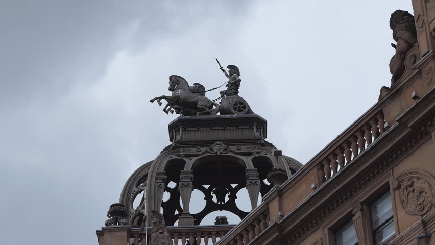 Statue of a Roman warrior and chariots.