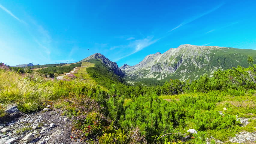 Picturesque summer view of High Tatras mountains near Strbske Pleso, Slovakia. Predne Solisko mount (2093m) in the center. Time Lapse. 4K UltraHD