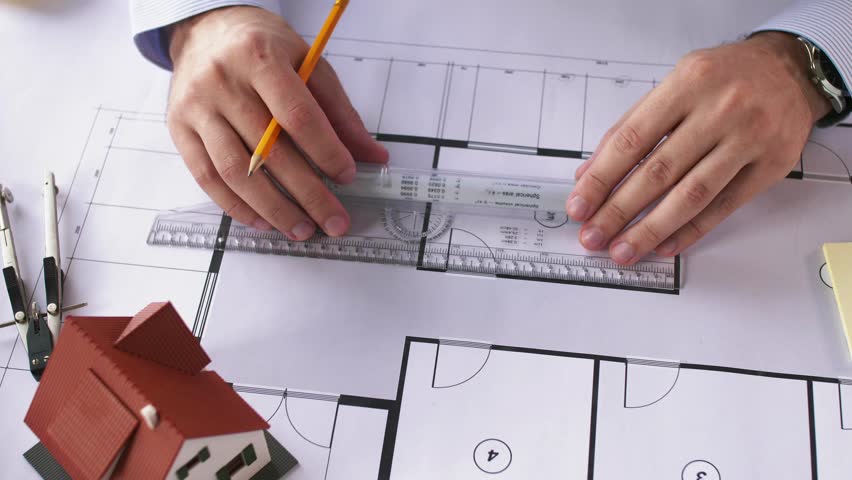 architects going over blueprints office Stock Footage Video (100% ...