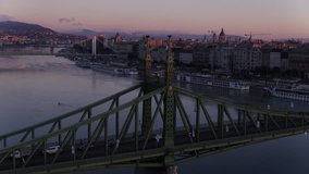 Aerial view of Budapest downtown and the Liberty Bridge in sunrise - drone video
