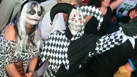  People in costumes of Joker dance at Halloween party in club October 31, 2016, New York, USA