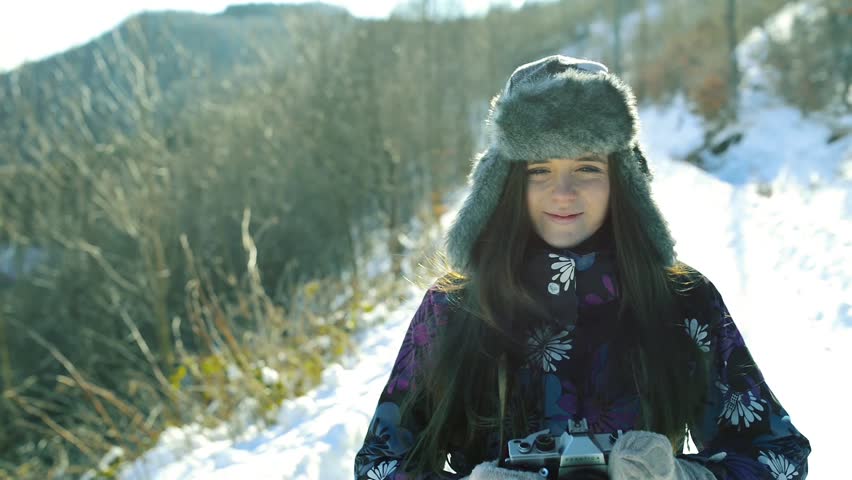 A teenager on a walk in winter nature.
