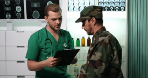 Medical Doctor Man Taking Notes on Clipboard Therapy Procedure Soldier Patient
