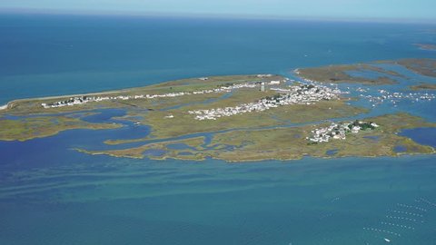 Tangier Island in Aerial close in Chesapeake Bay. Much of the remaining landmass is expected to be lost in the next 50 years, from sea level rise. A distinctive  English dialect is used there.