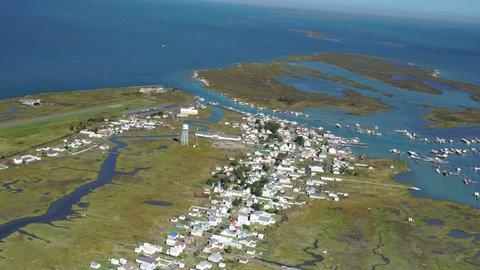 Tangier Island VILLAGE AERIAL in Chesapeake Bay. Much of the remaining landmass is expected to be lost in the next 50 years, from sea level rise. A distinctive  English dialect is used there.