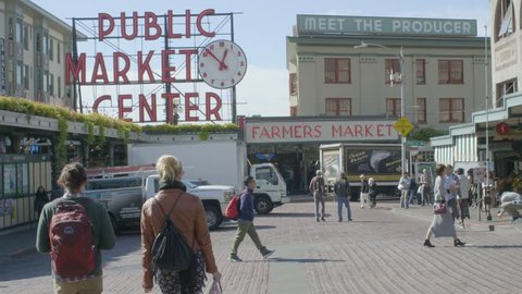 SEATTLE, WASHINGTON/USA - OCTOBER 4, 2017: Shoppers and Tourists Visit Pike Place Public Market Center a Famous Landmark With Seafood and Farmers Market