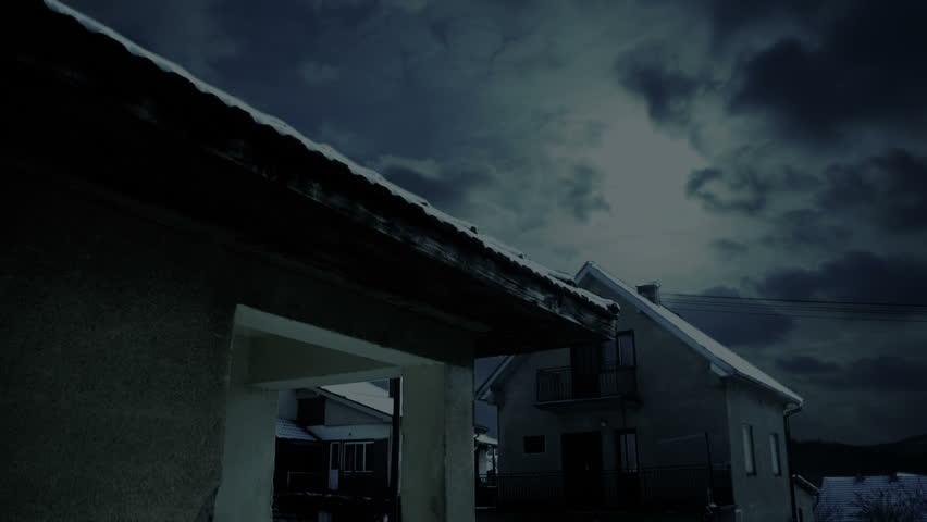 Sony FS100 - Spooky clouds over village houses - time lapse graded cold and dark 