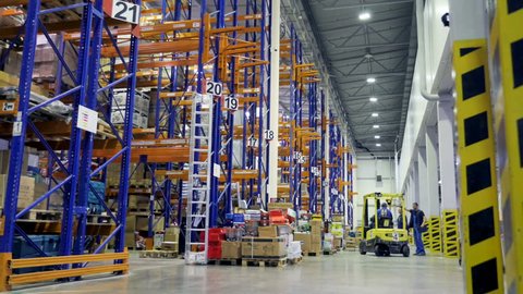 Timelapse of a large warehouse during work.