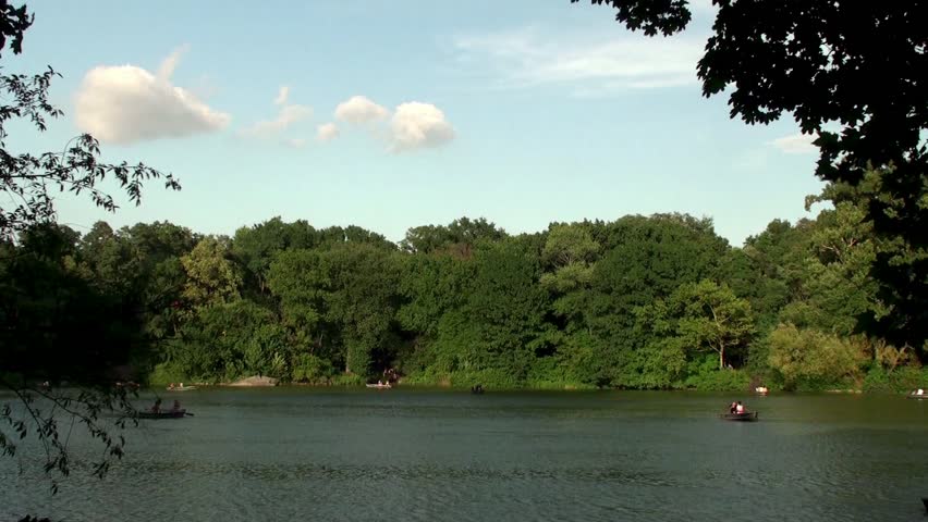 People in recreational rowing boats on the lake