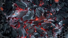 Video in slow motion of coal burning in a barbecue.