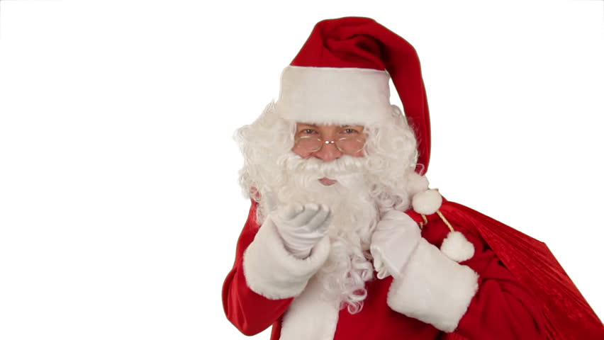 Santa Claus carrying his bag, is looking at the camera, sends a kiss and wave,