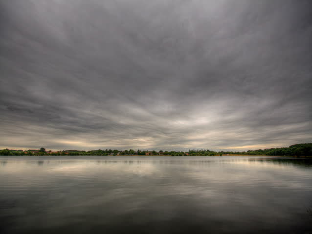 Impressive storm clouds over lake, HD time lapse clip, high dynamic range