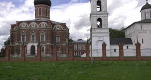 4K high quality video footage view of medieval beautiful Volokolamsk Kremlin with church, cathedral, walls around, hilly area near it in Volokolamsk near Moscow, capital of Russia in sunny summer day