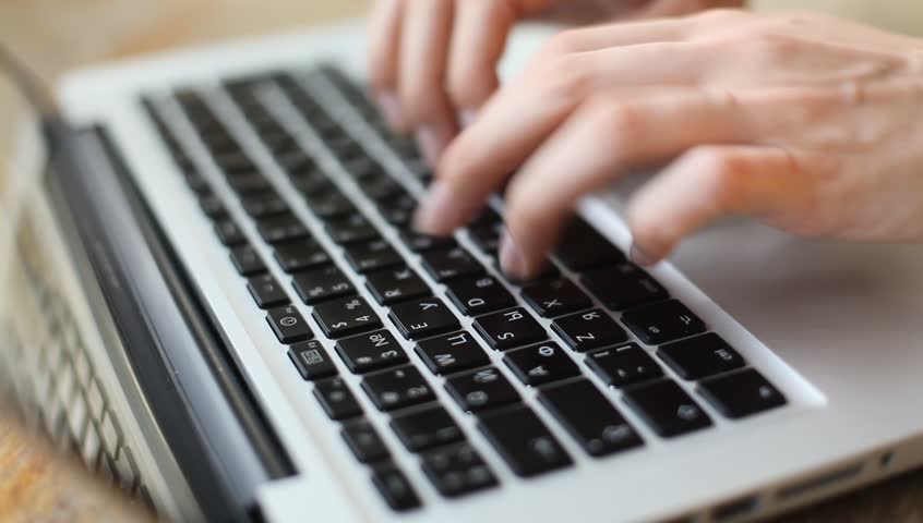 Woman hands typing on a laptop, close-up (HD)