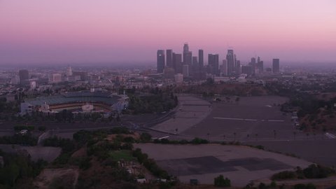 Los Angeles, California circa-2017, Flying by Dodger Stadium with downtown Los Angeles in distance. Shot with Cineflex and RED Epic-W Helium.