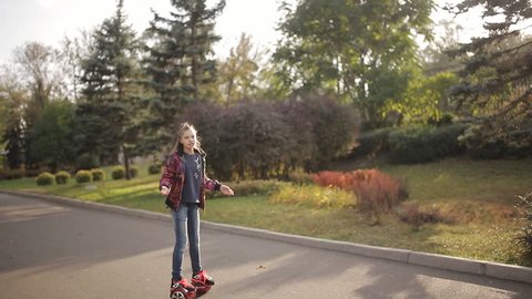 a girl sings songs and drives an electronic scooter