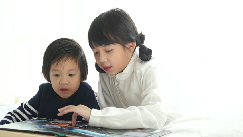 Cute Asian Children Reading a Stock Footage Video (100% Royalty-free)  31650541 | Shutterstock