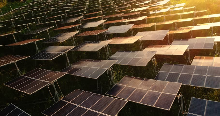 4K Aerial view of Solar Panels Farm (solar cell) with sunlight.Drone flight fly over solar panels field renewable green alternative energy concept in Thailand. | Shutterstock HD Video #31651372